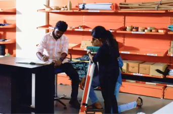 Students clearing doubts from Abate's faculty