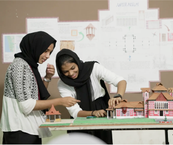 Students working on architectural model