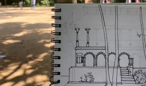 Interior design student proudly displaying their completed sketch