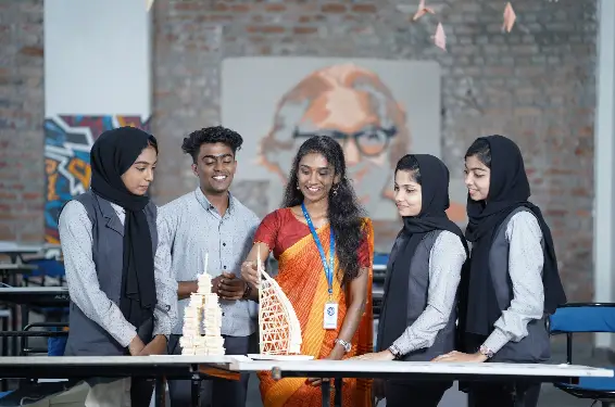 Architectural students presenting small-scale models of their designs